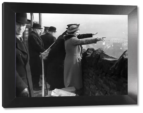 Queen Elizabeth visits Swansea to survey the damage caused by Nazi air raids. 1941