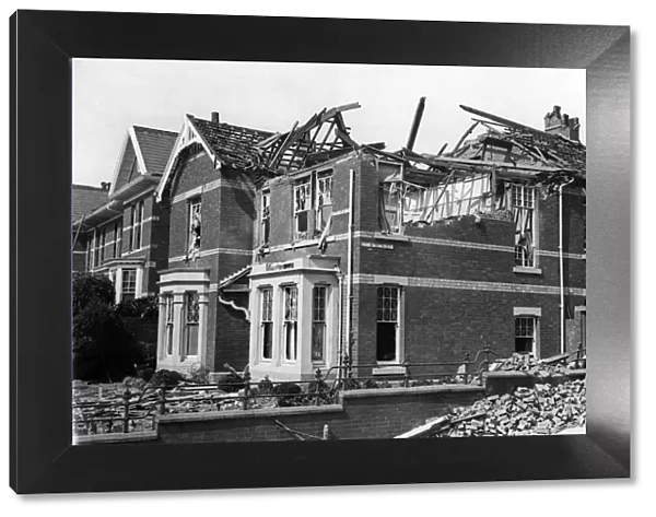 Damage done to a house on Eversley Road, Swansea, following a Nazi raid. February 1941
