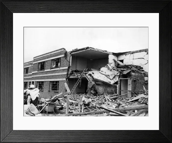 Framed Print : Damage done to workers houses after a raid on a South Wales town. October 1941 Framed Print : Damage done to workers houses after a raid on a South Wales town. October 1941