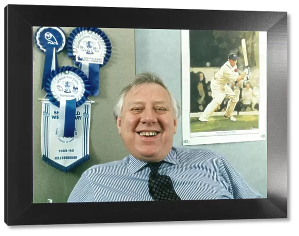 ROY HATTERSLEY IN HIS OFFICE WITH SHEFFIELD WEDNESDAY ROSETTES AND A PIC OF LEONARD