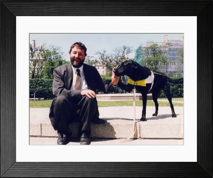 Framed Print : David Blunkett sitting outside Houses of Parliament with guide dog 26  /  05  /  1994