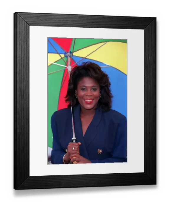 Framed Print : TESSA SANDERSON, ATHLETE - HOLDING MULTI-COLOURED UMBRELLA 15  /  07  /  1992