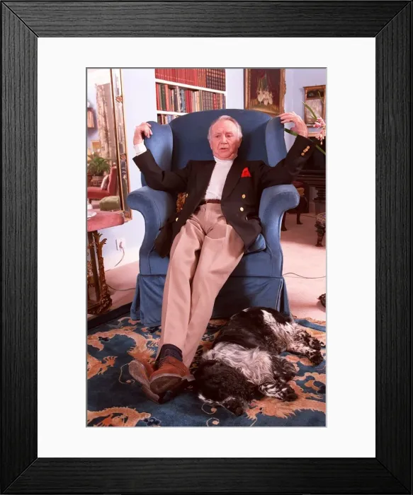 Framed Print : SIR JOHN MILLS IN PHOTO SHOOT AT HIS HOME SITTING IN ARMCHAIR WITH BOOKCASE AS BACKGROUND Framed Print : SIR JOHN MILLS IN PHOTO SHOOT AT HIS HOME SITTING IN ARMCHAIR WITH BOOKCASE AS BACKGROUND