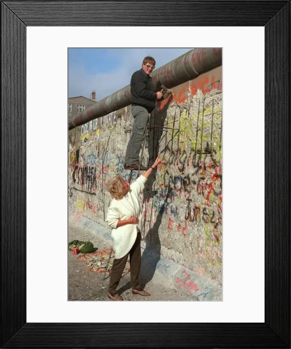 Framed Print : Souvenir pieces of the Berlin wall are being removed-pictured, Germany February 1990 Framed Print : Souvenir pieces of the Berlin wall are being removed-pictured, Germany February 1990