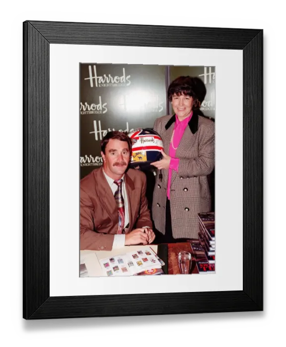 Framed Print : NIGEL MANSELL AND WOMAN AT HARRODS PROMOTION HOLDING A DRIVING HELMET 08 / 12 / 1992 Framed Print : NIGEL MANSELL AND WOMAN AT HARRODS PROMOTION HOLDING A DRIVING HELMET 08 / 12 / 1992