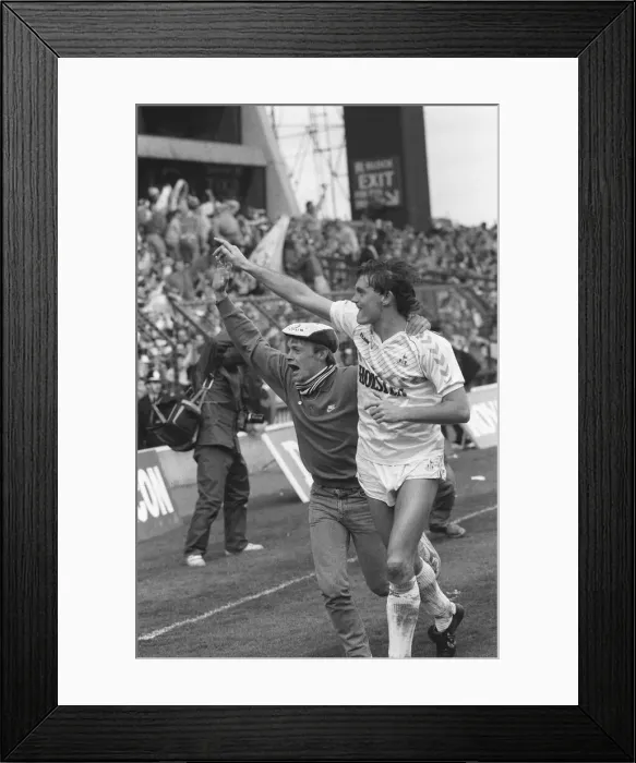 Framed Print : Glenn Hoddle running with a fan on the pitch after the match Framed Print : Glenn Hoddle running with a fan on the pitch after the match