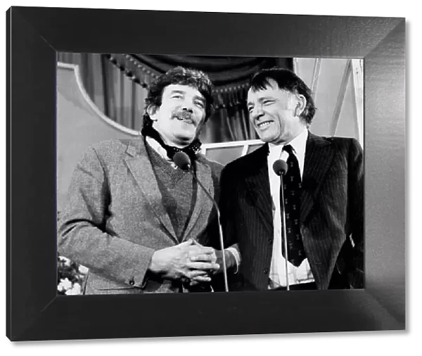 Albert Finney and Richard Burton at press conference laughing - February 1977