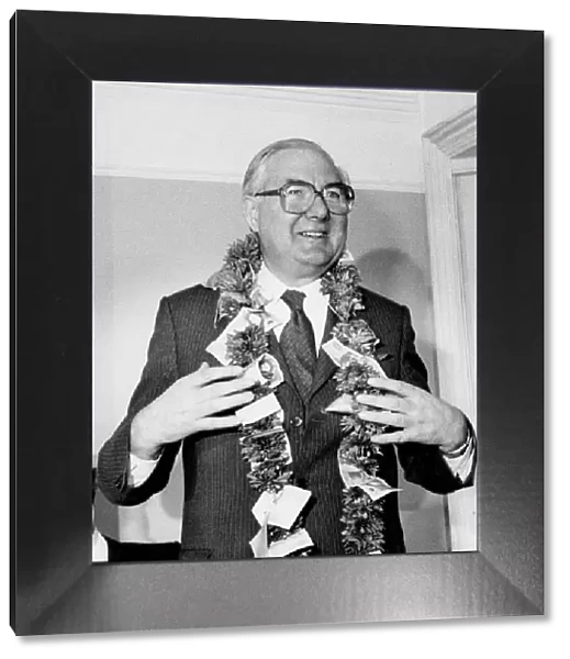 James Callaghan wearing garland of flowers and money in Brentford - April 1979
