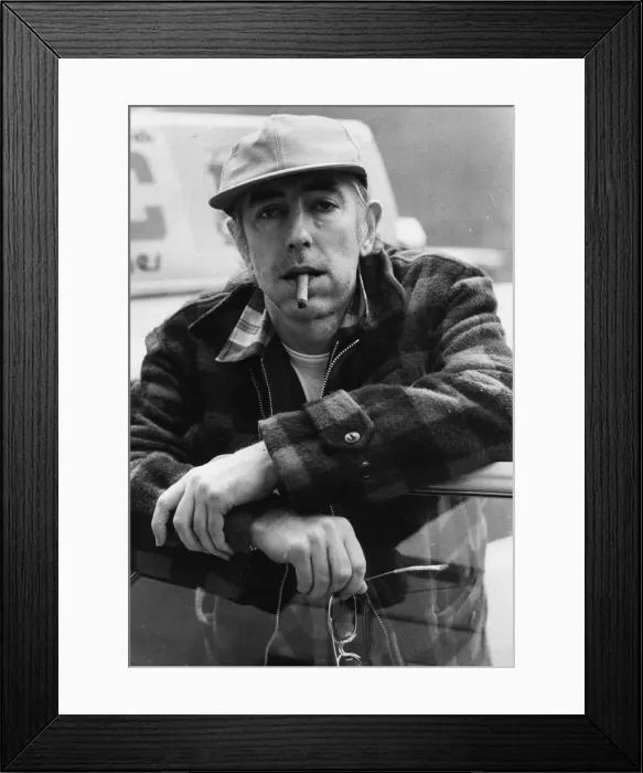 Framed Print : Peter Cook, satirist pictured smoking a cigar - April 1980 22  /  04  /  1980