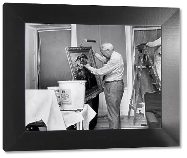 Edward Heath inspecting bomb damaged painting as workmen make repairs - January 1975