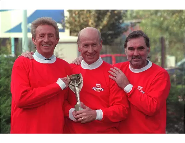 Denis Law with Bobby Charlton and George Best hold 1966 World Cup replica