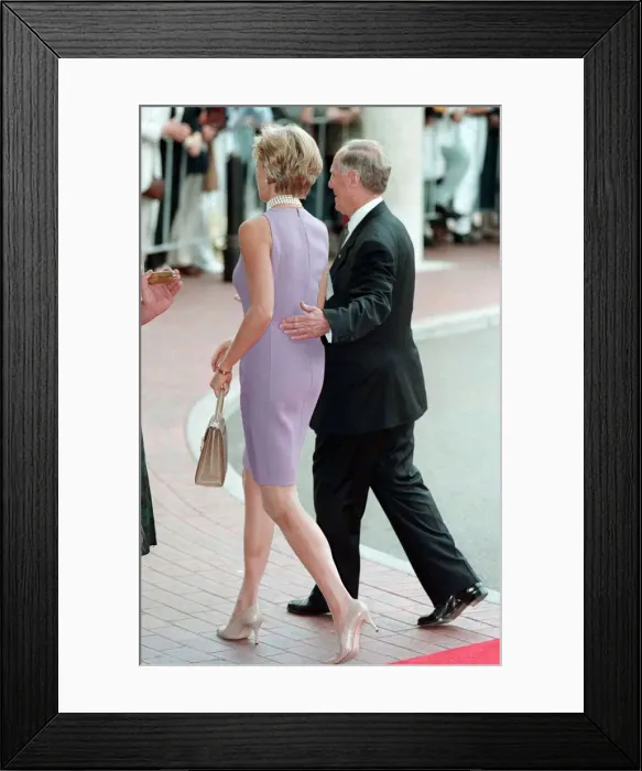Framed Print : Princess Diana, wearing a purple dress is escorted to lunch by Australian dignitary Tom Framed Print : Princess Diana, wearing a purple dress is escorted to lunch by Australian dignitary Tom