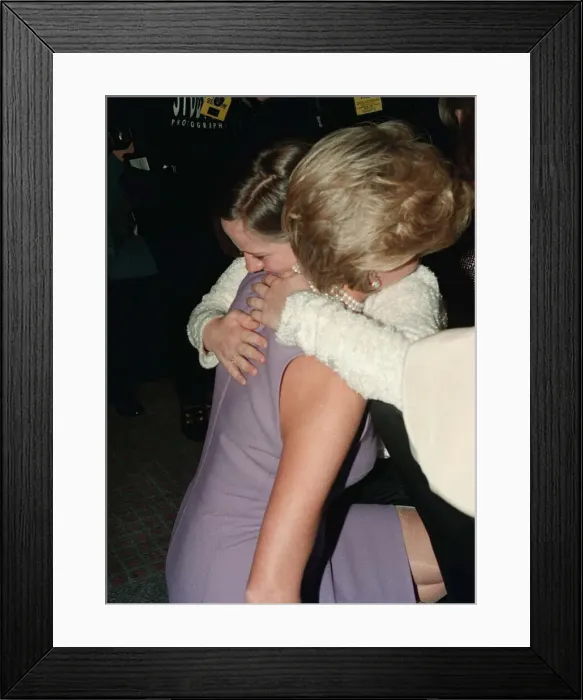 Framed Print : Princess Diana, wearing a purple dress, hugs Emma Jones at a Commonwealth Day luncheon in Framed Print : Princess Diana, wearing a purple dress, hugs Emma Jones at a Commonwealth Day luncheon in