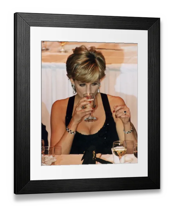 Framed Print : Princess Diana wears black evening dress during a reception where she was to receive a Framed Print : Princess Diana wears black evening dress during a reception where she was to receive a