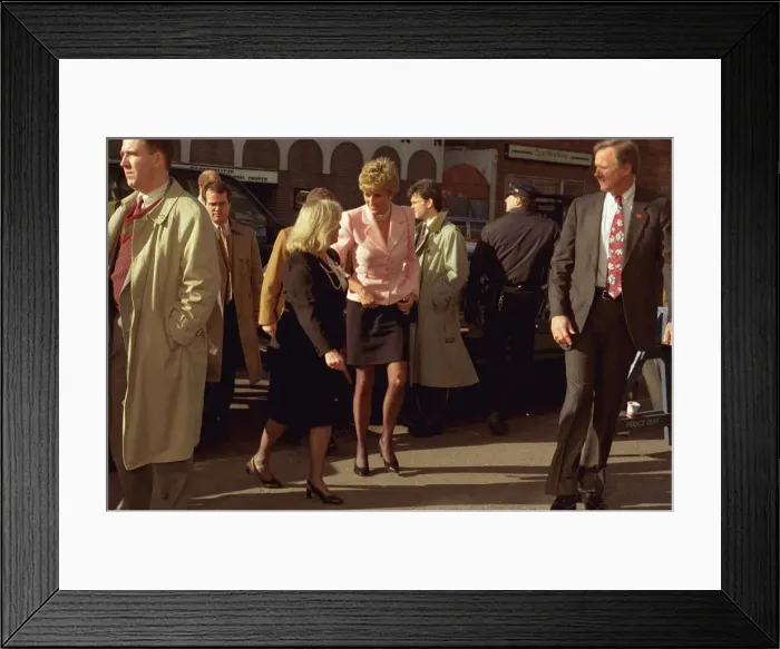 Framed Print : Princess Diana in Harlem wearing black skirt, black tights and creme jacket (undated)