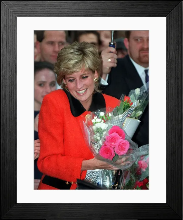 Framed Print : PRINCESS DIANA WEARS A RED SUIT, SMILES AND CARRIES FLOWERS DURING A VISIT TO THE ENGLISH Framed Print : PRINCESS DIANA WEARS A RED SUIT, SMILES AND CARRIES FLOWERS DURING A VISIT TO THE ENGLISH