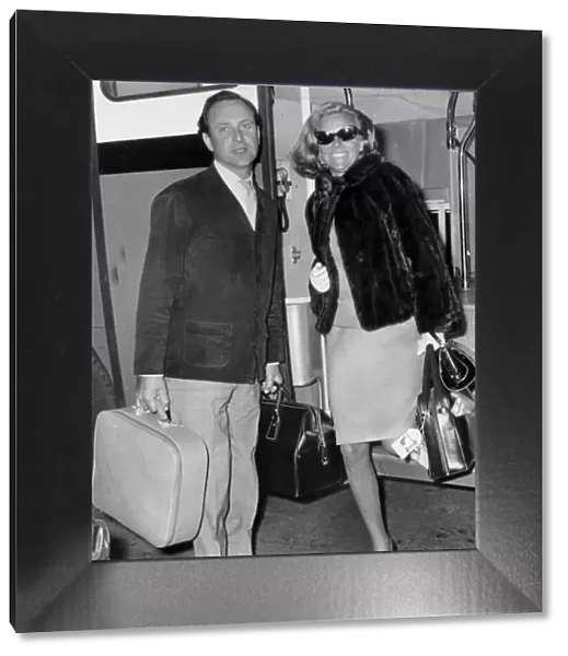 Honor Blackman and David Jacobs at London airport - May 1966 -----