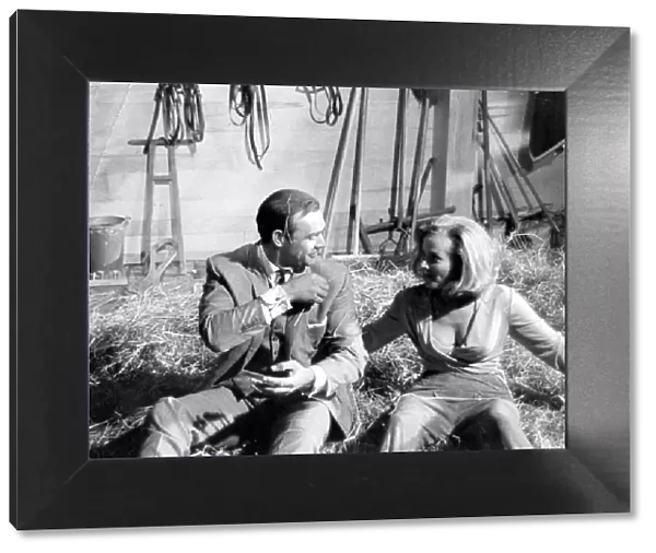 Honor Blackman and Sean Connery in haystack during filming of Goldfinger - June 1964