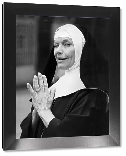 Honor Blackman dressed as a nun for photo call - February 1987
