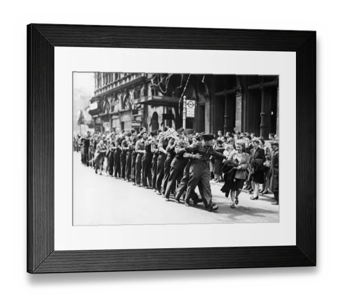 Framed Print : Serviceman in Piccadilly, London, shortly after VE Day. The celebrations for end of