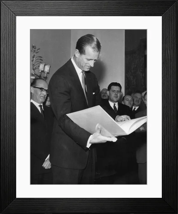Framed Print : The Duke of Edinburgh. Prince Phillip receives a cookbook from the Variety club