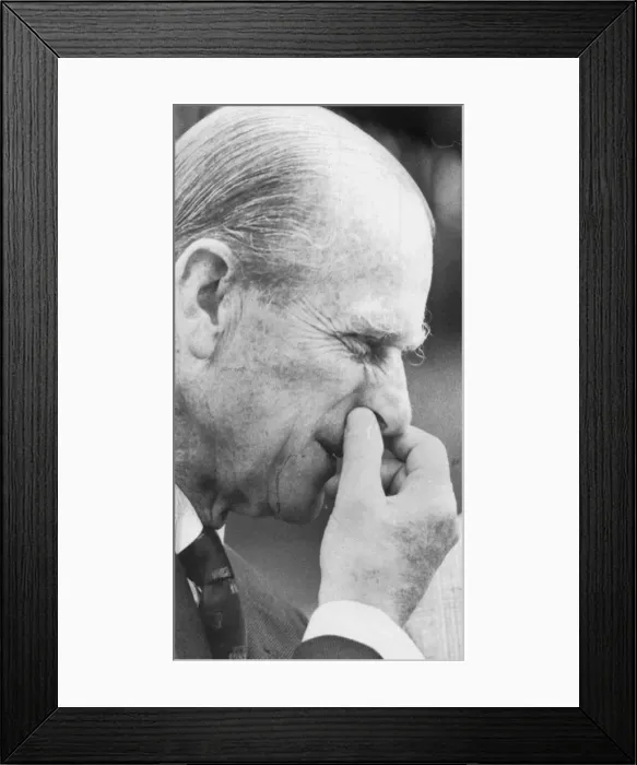 Framed Print : The Duke of Edinburgh pinching his nose while visiting a farm - June 1963 Framed Print : The Duke of Edinburgh pinching his nose while visiting a farm - June 1963