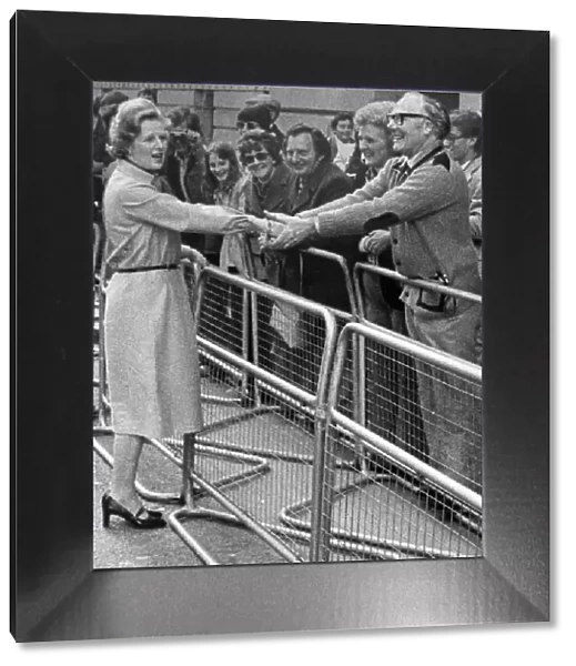 Margaret Thatcher shaking hands with fan during walkabout 08  /  05  /  1979
