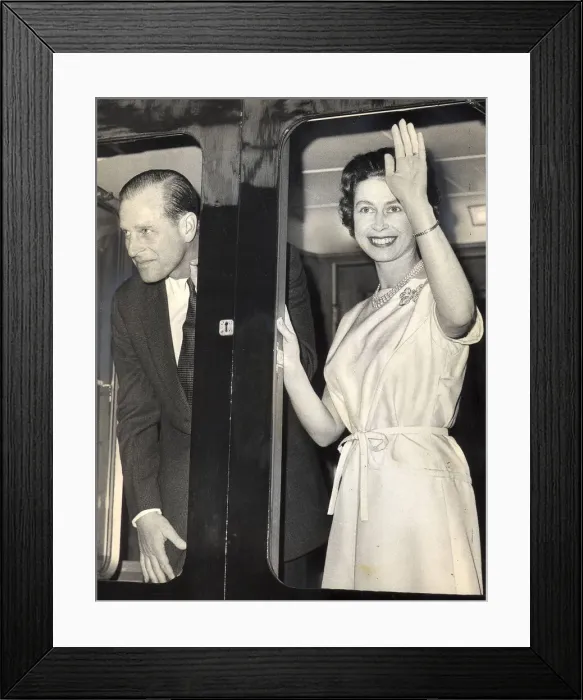 Framed Print : The Duke of Edinburgh, Prince Phillip and Queen Elizabeth II wave to the crowds as they Framed Print : The Duke of Edinburgh, Prince Phillip and Queen Elizabeth II wave to the crowds as they