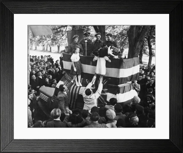 Framed Print : Two little girls being hoisted to the platform to present a bouquet of roses to a French