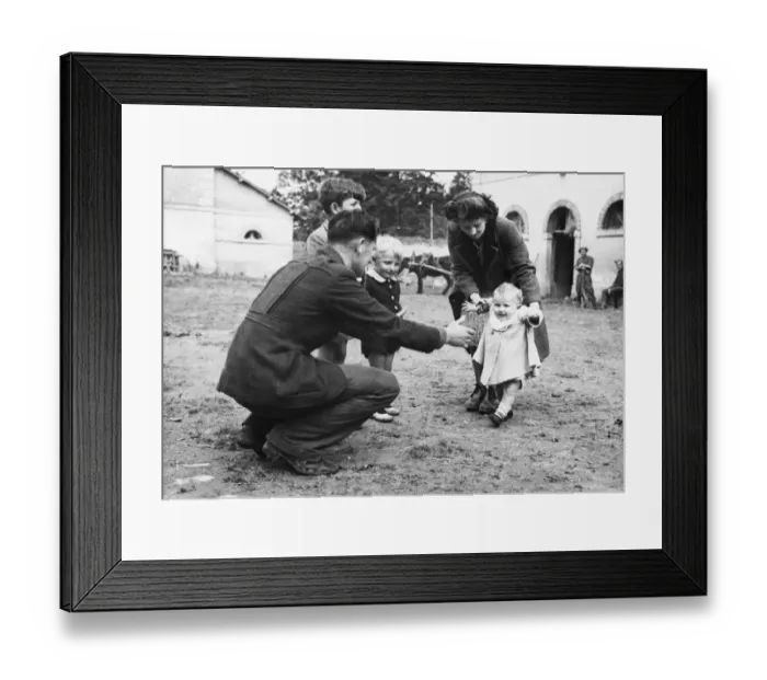 Framed Print : Teaching the baby to walk in the grounds of the camp for refugees in Normandy