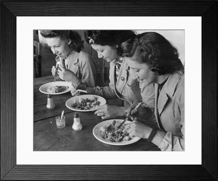 Framed Print : Female munition workers enjoy their lunch. The chef has given the chinese lady in Framed Print : Female munition workers enjoy their lunch. The chef has given the chinese lady in