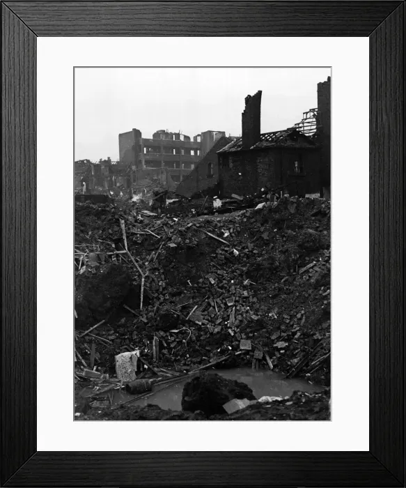 Framed Print : Raid damage at Hillsborough, Sheffield. Where the hole is seen in foreground stood a
