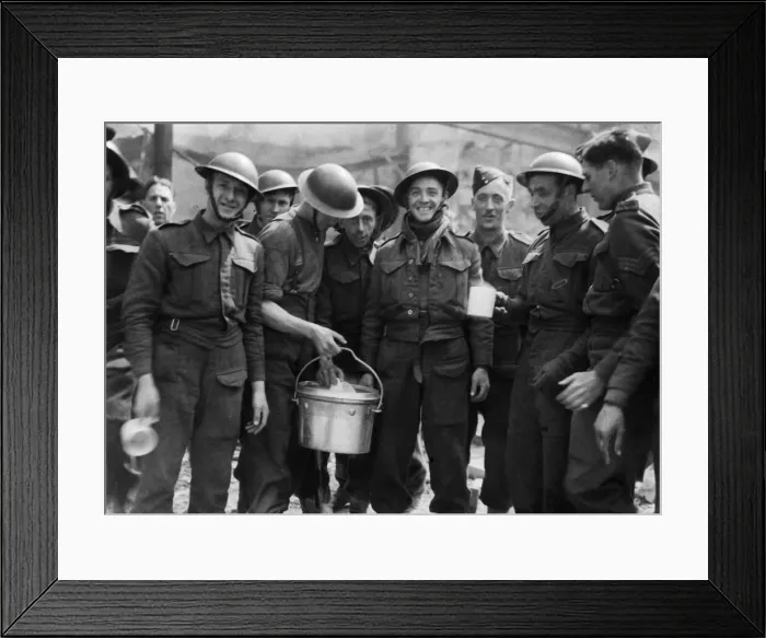 Framed Print : Soldiers helping to clear up the wreckage after a raid on Humberside pose for a welcome Framed Print : Soldiers helping to clear up the wreckage after a raid on Humberside pose for a welcome