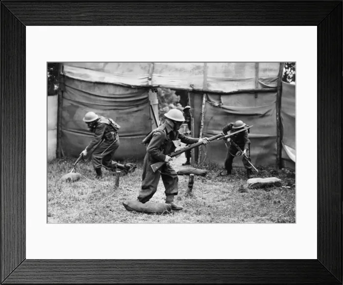 Framed Print : The winning team clearing up enemy headquarters during an inter-team competition held Framed Print : The winning team clearing up enemy headquarters during an inter-team competition held