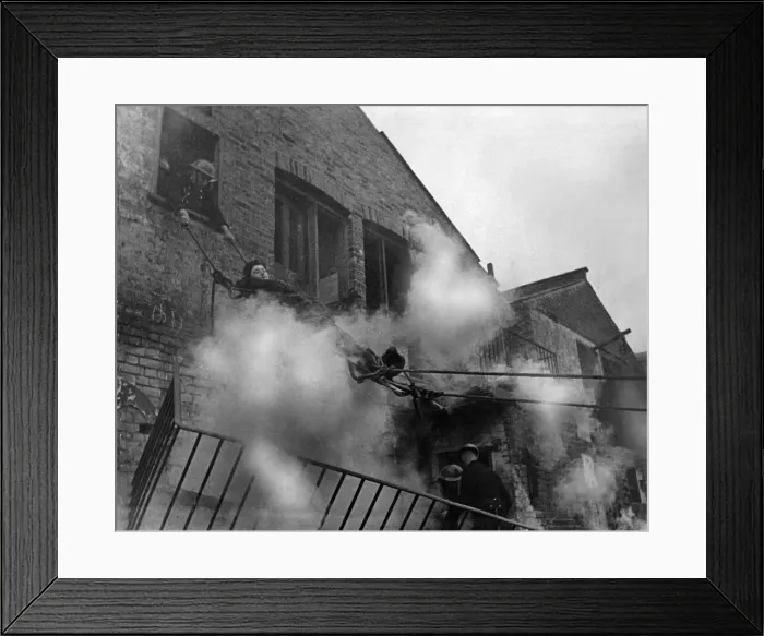 Framed Print : NFS Task division training exercise on lowering casualty from an upper floor of a bombed Framed Print : NFS Task division training exercise on lowering casualty from an upper floor of a bombed