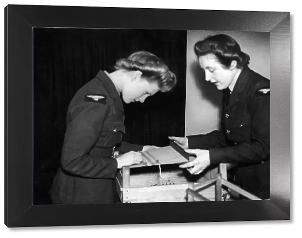 Members of the Womens Auxiliary Air Force being taught the age old craft of '