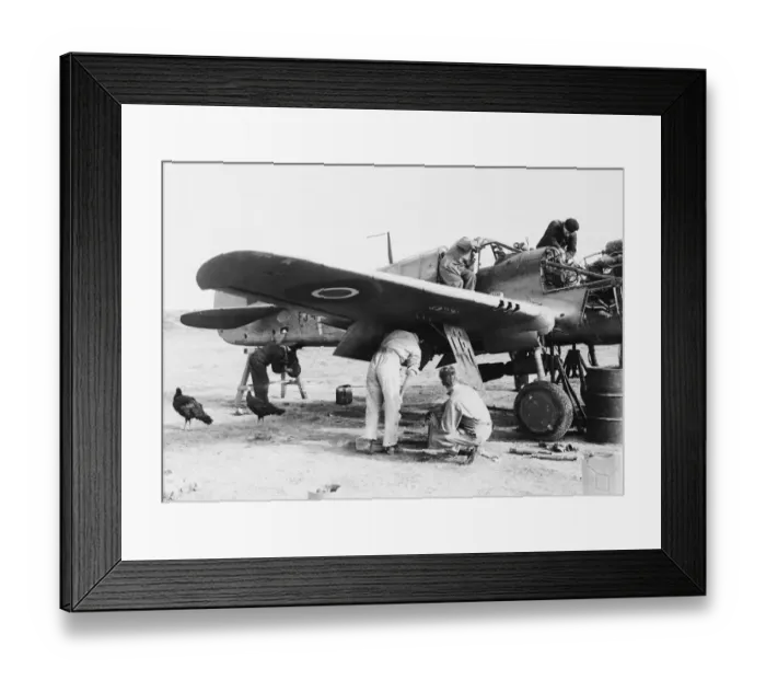 Framed Print : R. A. F. AT Advanced airfield in Italy. R. A. F. fitters busily at work on an aircraft Framed Print : R. A. F. AT Advanced airfield in Italy. R. A. F. fitters busily at work on an aircraft