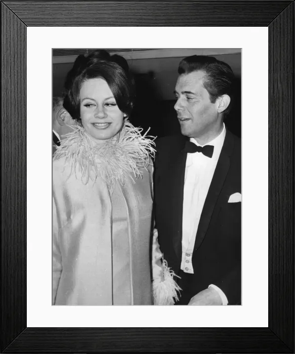 Framed Print : Sarah Miles and Dirk Bogarde at film premiere - April 1964