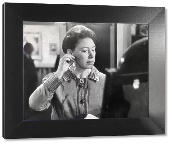 Princess Margaret tries on new earrings Valued at £