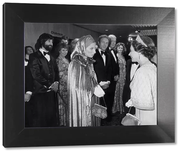 The Queen meeting Barbra Streisand watched by James Caan
