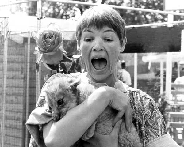 Glenda Jackson being bitten by lion cub during visit to Chelsea Flower Show - May 1980