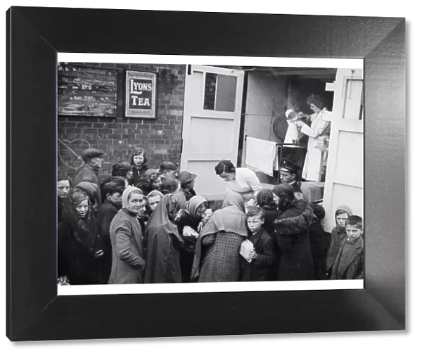 Picture shows a mobile canteen, serving tea to the local people of Hull during World War
