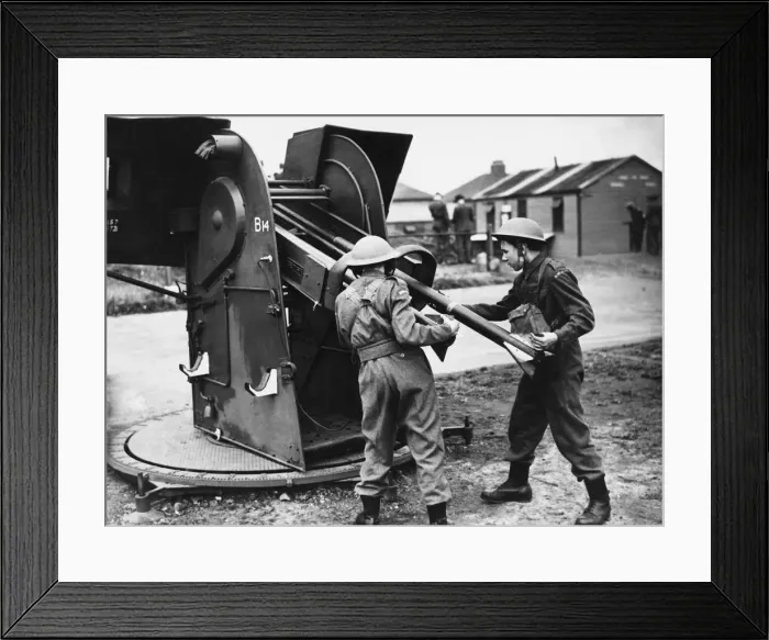 Framed Print : First pictures of the Home Guard A. A in action loading a projector. 8th July 1942 Framed Print : First pictures of the Home Guard A. A in action loading a projector. 8th July 1942