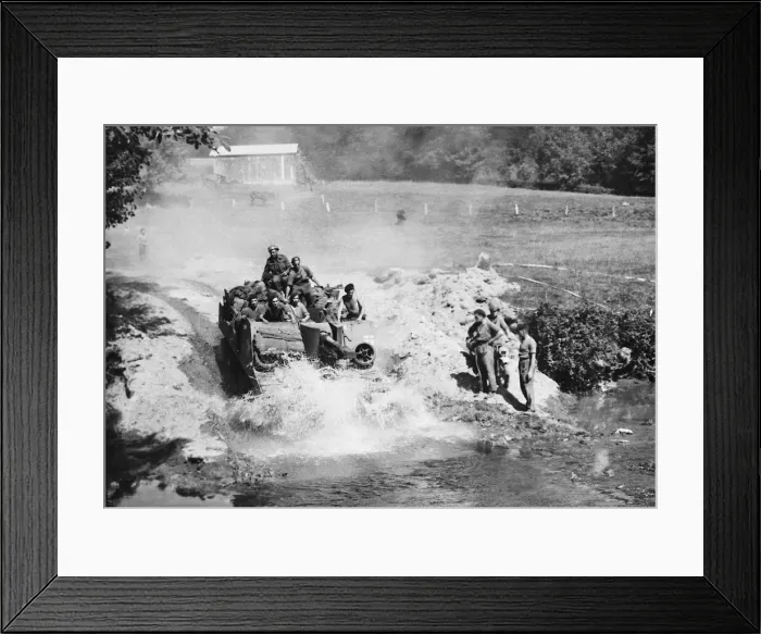 Framed Print : A British Self Propelled gun plunges through a stream in pursuit of the German 7th army