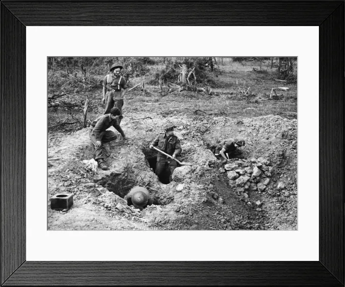 Framed Print : On the fringes of the village Hottot near Tilly Sur Seulles troops dig themselves in