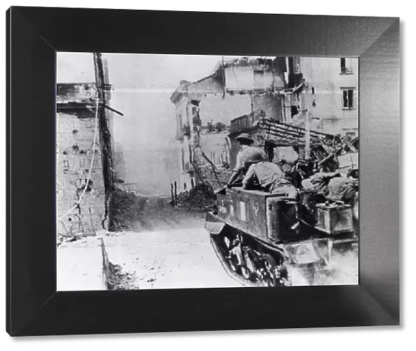 British army in a Bren Gun Carrier driving through Salerno
