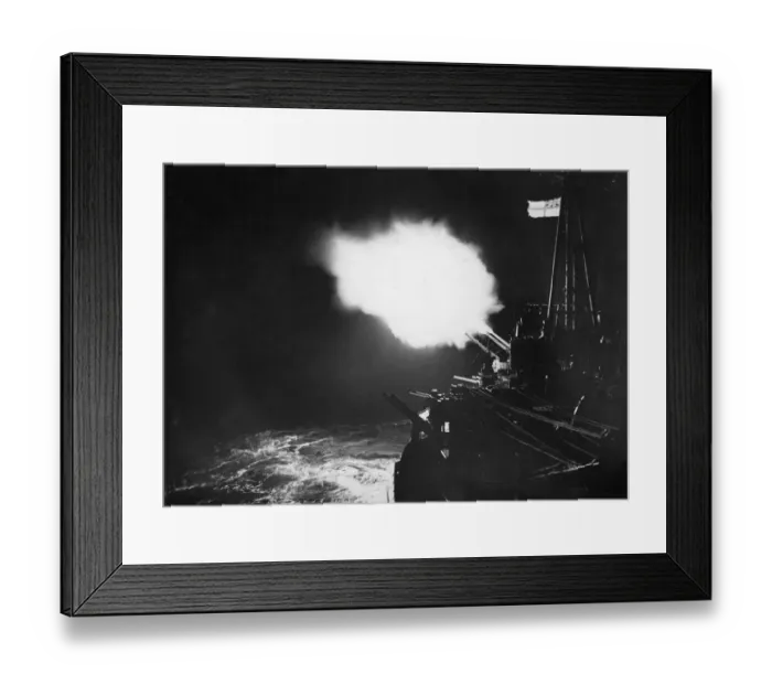 Framed Print : The battle ensign of HMS Mauritius crowning the night scene as the cruiser Framed Print : The battle ensign of HMS Mauritius crowning the night scene as the cruiser