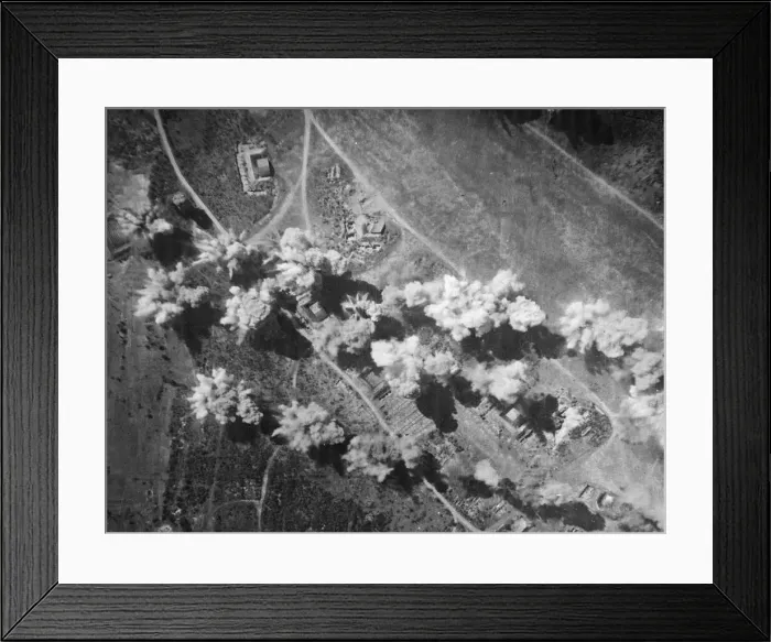 Framed Print : Sticks of bombs explode on and around hangars, dispersal points