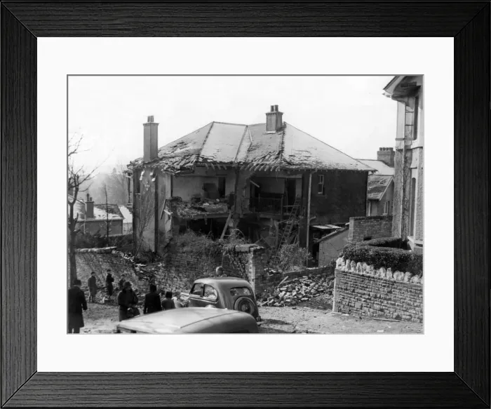 Framed Print : A damaged house in South Wales following an attack by Nazi raiders. Circa 1941 Framed Print : A damaged house in South Wales following an attack by Nazi raiders. Circa 1941
