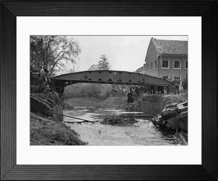 Framed Print : A self propelled Scissors'bridge laid out over a river by British soldiers Framed Print : A self propelled Scissors'bridge laid out over a river by British soldiers